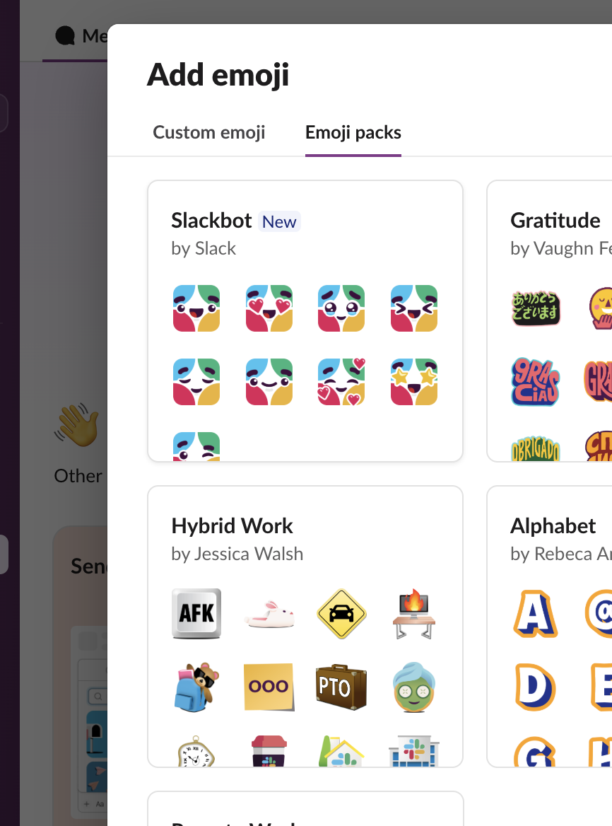The Emoji packs tab in Slack's Add emoji dialog, web app, 29 September 2026: Slackbot by Slack, Gratitude by Vaughn Fender, Hybrid Work by Jessica Walsh, Alphabet by Rebeca Anaya and Remote Work by Jen Lewis