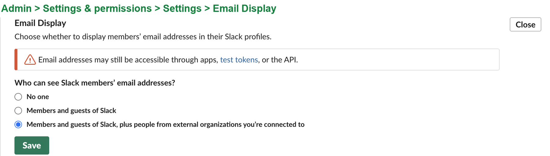 The Email Display section of Slack's admin settings, expanded. A warning reads Email addresses may still be accessible through apps, test tokens, or the API. Three choices follow: No one, Members and guests of the workspace, and Members and guests plus people from external organizations, which is selected